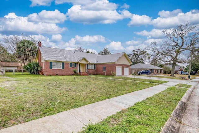 3570 Firestone Blvd, Pensacola, FL 32503 - ranch-style house with driveway, a front yard, a chimney, an attached garage, and brick siding