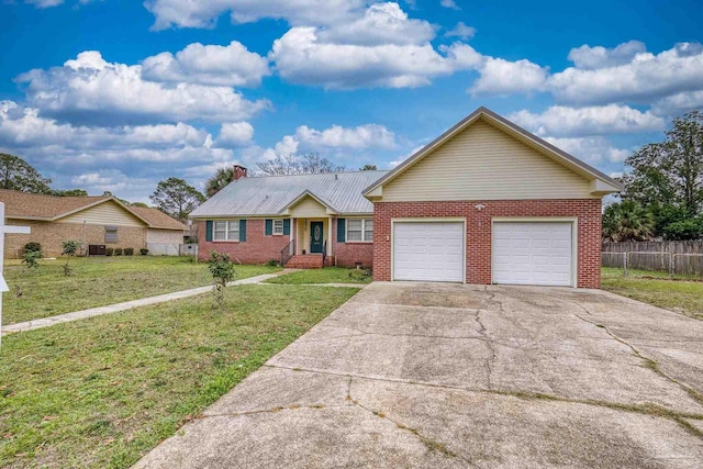 3570 Firestone Blvd, Pensacola, FL 32503 - ranch-style home with brick siding, a front yard, concrete driveway, and an attached garage