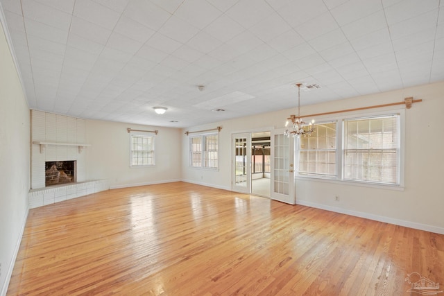 3570 Firestone Blvd, Pensacola, FL 32503 - unfurnished living room featuring baseboards, visible vents, a chandelier, and light wood-type flooring