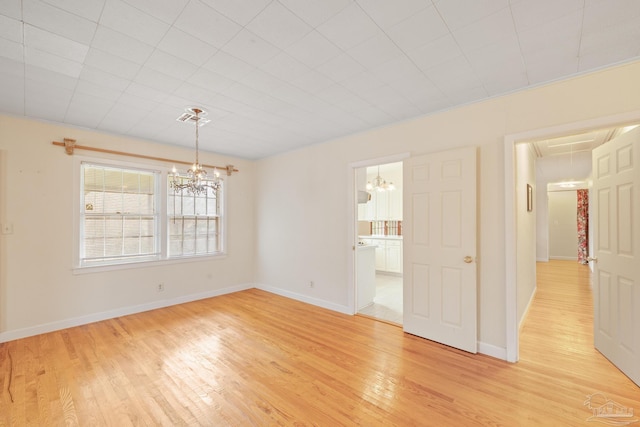 3570 Firestone Blvd, Pensacola, FL 32503 - empty room featuring an inviting chandelier, baseboards, light wood-style floors, and visible vents