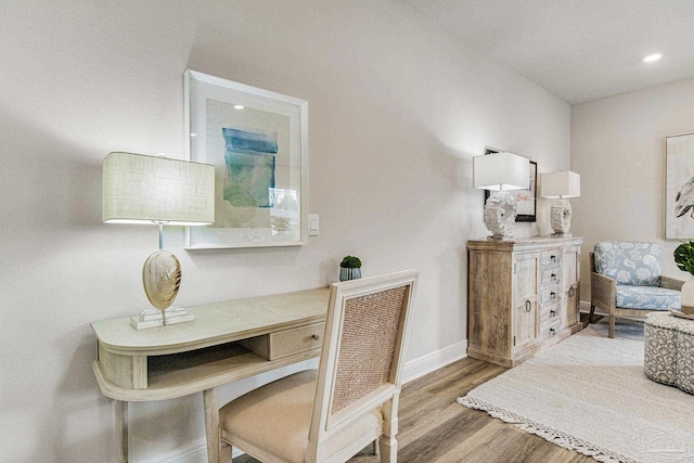 office space with recessed lighting, light wood-type flooring, and baseboards