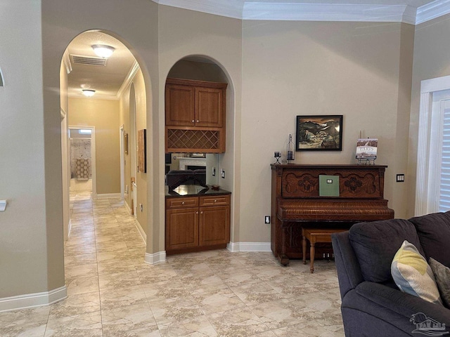 1988 Heritage Park Way, Navarre, FL 32566 - living area with ornamental molding, baseboards, arched walkways, and light marble finish floors