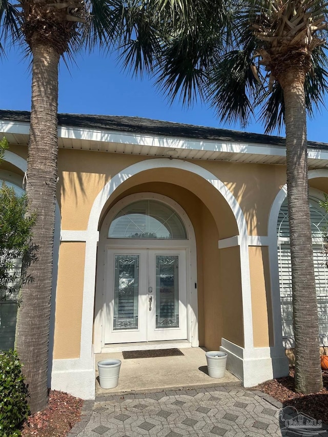 1988 Heritage Park Way, Navarre, FL 32566 - property entrance with french doors and stucco siding