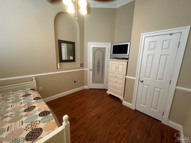 1988 Heritage Park Way, Navarre, FL 32566 - bedroom featuring dark wood-style flooring, baseboards, a ceiling fan, and crown molding