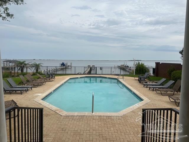 1988 Heritage Park Way, Navarre, FL 32566 - community pool with a patio area and a water view