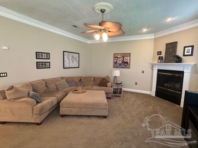 1988 Heritage Park Way, Navarre, FL 32566 - living room with carpet flooring, ceiling fan, a glass covered fireplace, crown molding, and baseboards