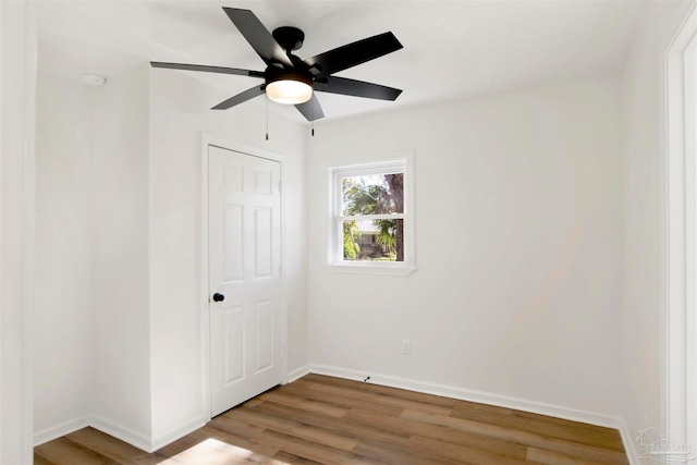 spare room featuring ceiling fan and light hardwood / wood-style floors