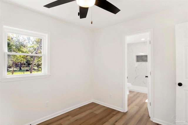 unfurnished room featuring ceiling fan and light wood-type flooring