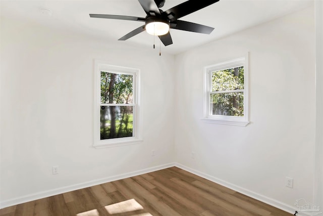 empty room featuring hardwood / wood-style flooring and ceiling fan