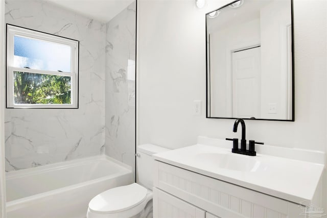 full bathroom with vanity, toilet, and tiled shower / bath combo