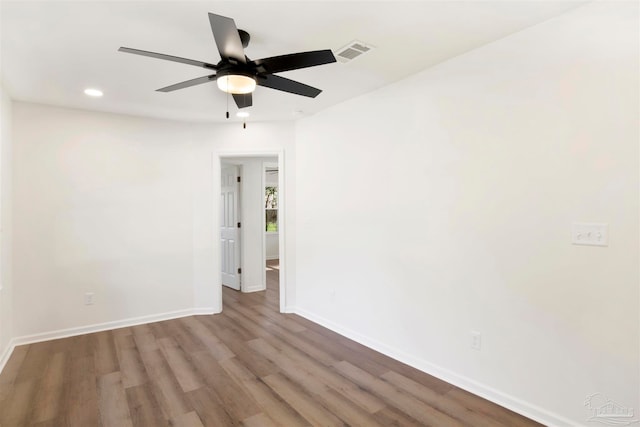 spare room with ceiling fan and hardwood / wood-style floors