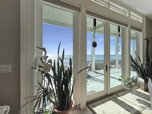 doorway featuring french doors and a water view