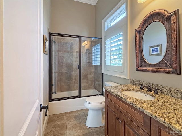 full bath with toilet, vanity, and enclosed tub / shower combo