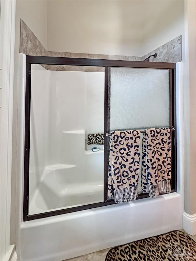 full bath with a shower with shower door