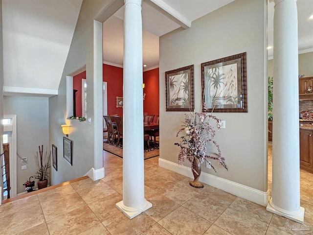 interior space with ornamental molding, decorative columns, baseboards, and light tile patterned floors