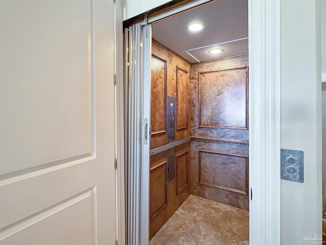 details with elevator and recessed lighting