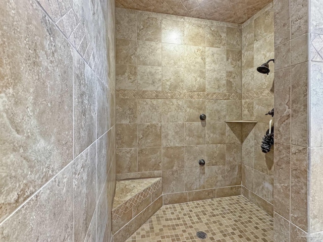 bathroom featuring a tile shower