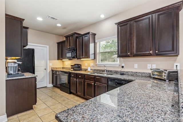 kitchen featuring visible vents, dark brown cabinetry, recessed lighting, black appliances, and a sink