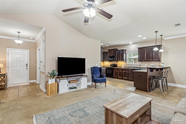 living room with visible vents, baseboards, light colored carpet, and ornamental molding