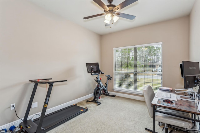 home office with a ceiling fan, baseboards, and carpet floors