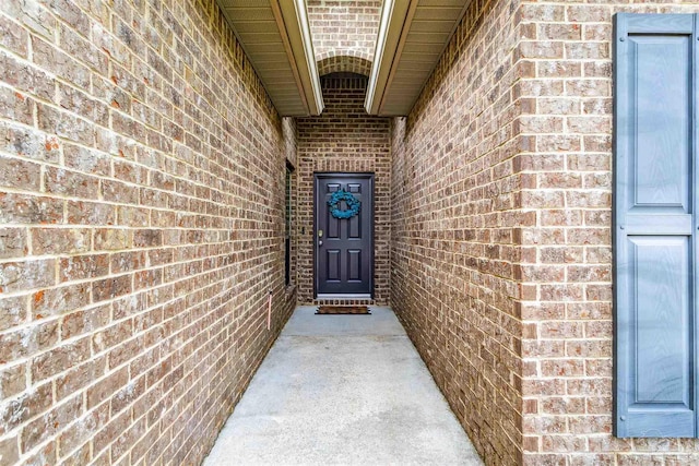 property entrance with brick siding