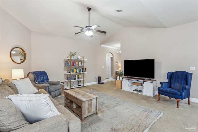 living room with visible vents, baseboards, carpet floors, arched walkways, and a ceiling fan