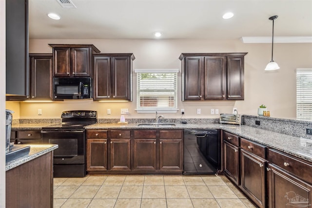 kitchen featuring black appliances, recessed lighting, dark brown cabinetry, and a sink