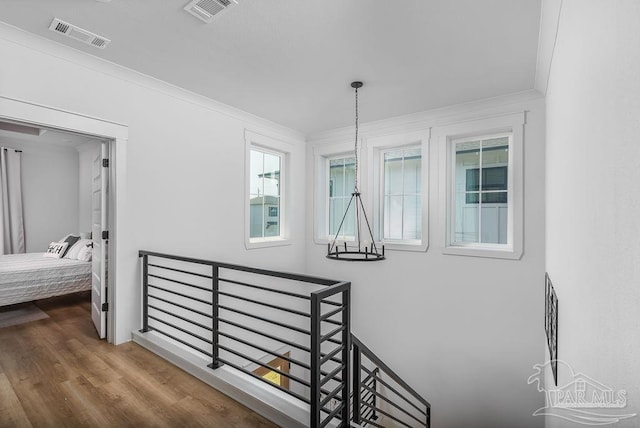5611 Trout Ln, Pensacola, FL 32507 - staircase featuring wood finished floors and ornamental molding