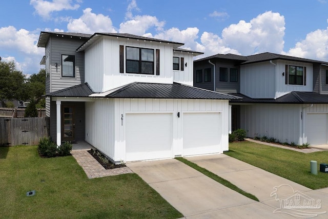 5611 Trout Ln, Pensacola, FL 32507 - modern farmhouse style home with an attached garage, concrete driveway, metal roof, and board and batten siding