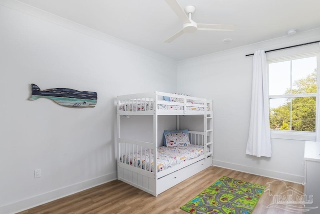 5611 Trout Ln, Pensacola, FL 32507 - bedroom with wood finished floors, baseboards, and ceiling fan