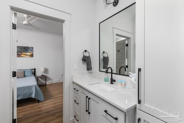 5611 Trout Ln, Pensacola, FL 32507 - bathroom featuring vanity, wood finished floors, a ceiling fan, and crown molding