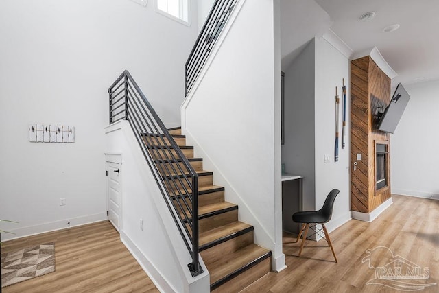 5611 Trout Ln, Pensacola, FL 32507 - stairway featuring wood finished floors and baseboards