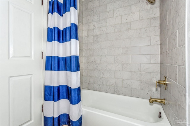 bathroom featuring shower / bath combo with shower curtain