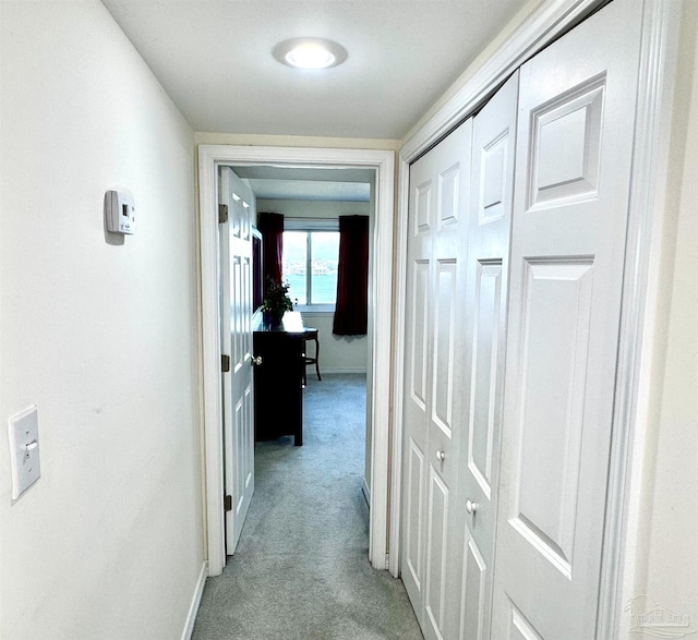 hallway with light carpet