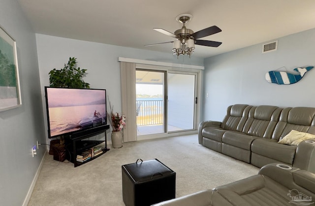 living room featuring ceiling fan and light carpet