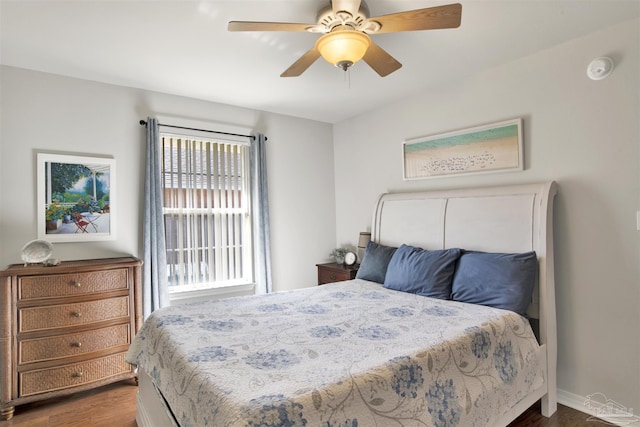 bedroom featuring ceiling fan and dark wood-type flooring