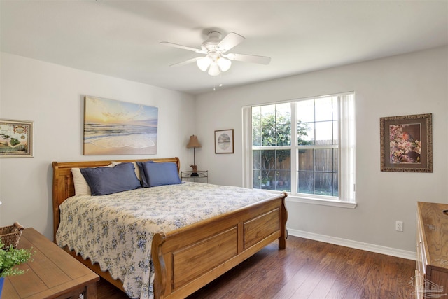 bedroom featuring ceiling fan and dark hardwood / wood-style flooring