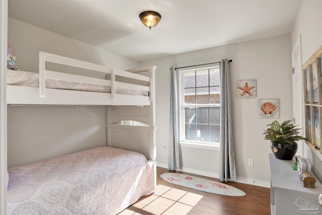 bedroom with hardwood / wood-style flooring