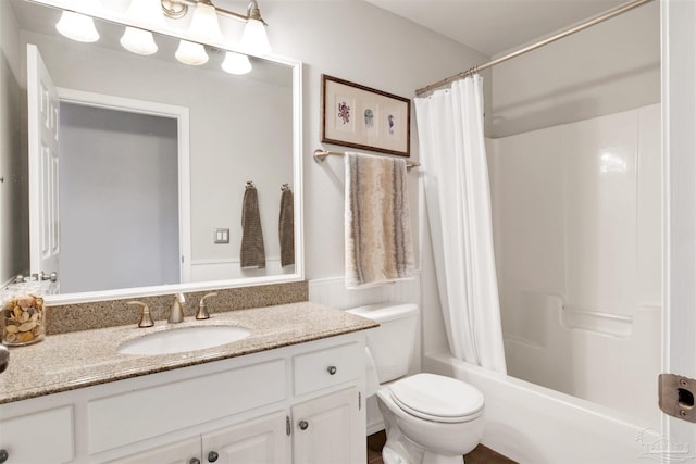 full bathroom with toilet, shower / tub combo, and vanity