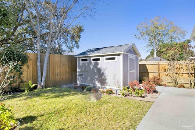 view of outdoor structure featuring a lawn