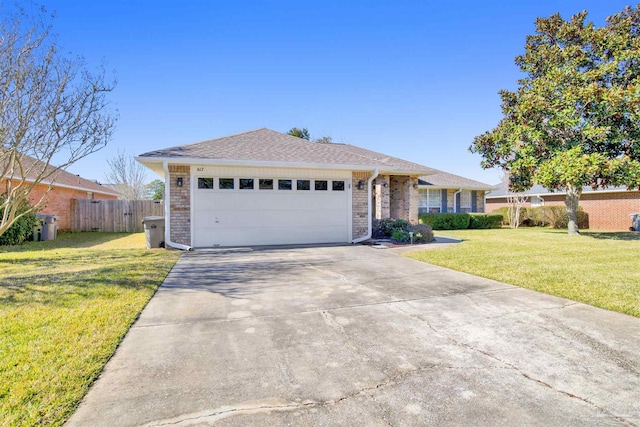 ranch-style home with a garage and a front yard