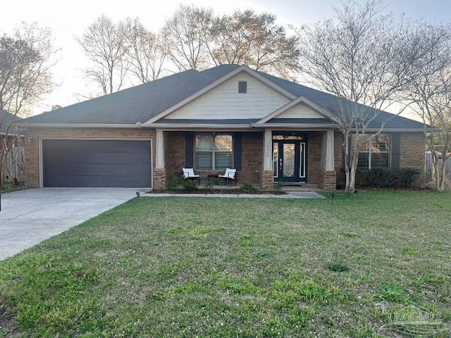 view of front of property with a garage and a front lawn