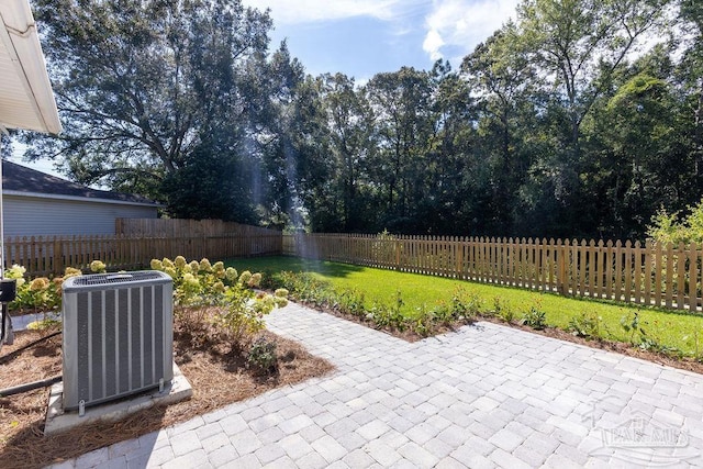 view of patio featuring cooling unit and a fenced backyard