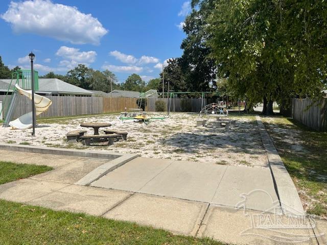 view of patio with a fenced backyard and a playground