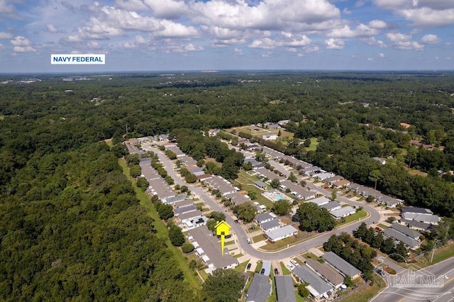 aerial view featuring a wooded view