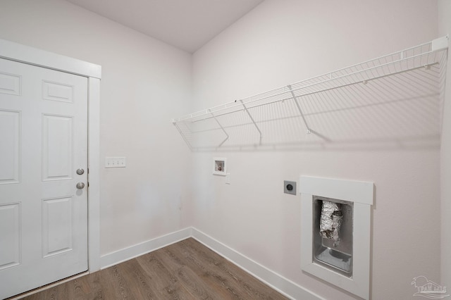 laundry area featuring dark hardwood / wood-style floors, washer hookup, and hookup for an electric dryer