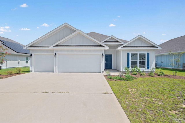 view of front of property with a garage and a front yard