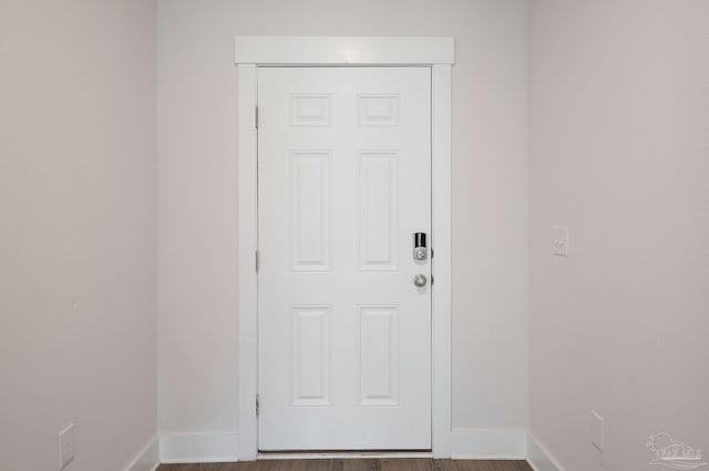 doorway with hardwood / wood-style floors