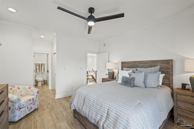 bedroom featuring crown molding, ceiling fan, connected bathroom, and light wood-type flooring