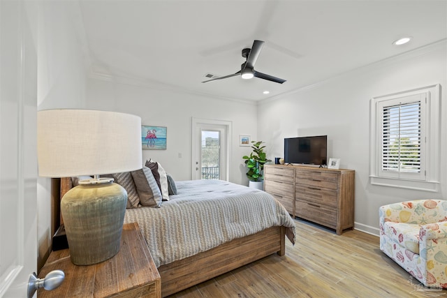 bedroom featuring crown molding, access to outside, and light hardwood / wood-style floors